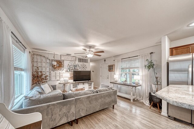 310 Chipeta Ave, Poncha Springs, CO 81242 - living area with ceiling fan, light wood-style flooring, and baseboards
