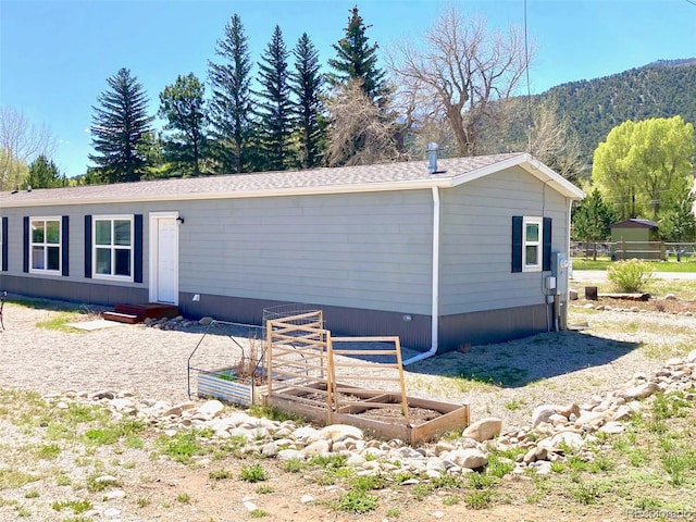 310 Chipeta Ave, Poncha Springs, CO 81242 - view of property exterior with a vegetable garden and a mountain view