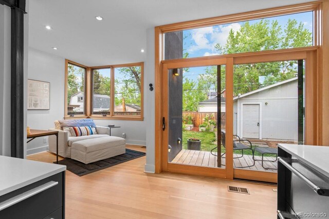 entryway featuring light wood finished floors and recessed lighting
