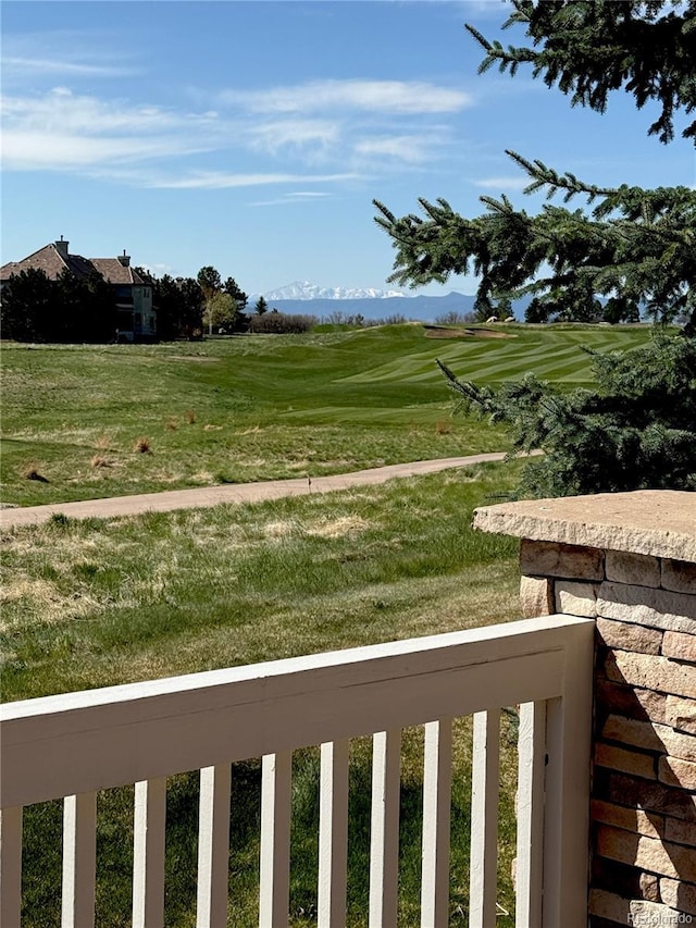 view of yard with a balcony