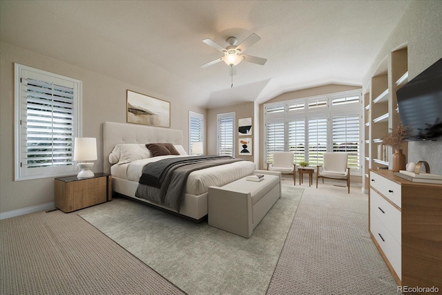 bedroom featuring baseboards, ceiling fan, lofted ceiling, and light colored carpet