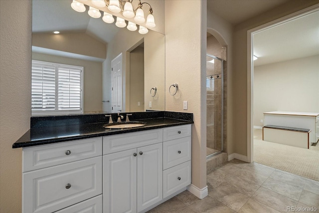full bath featuring a shower stall, tile patterned flooring, and vanity