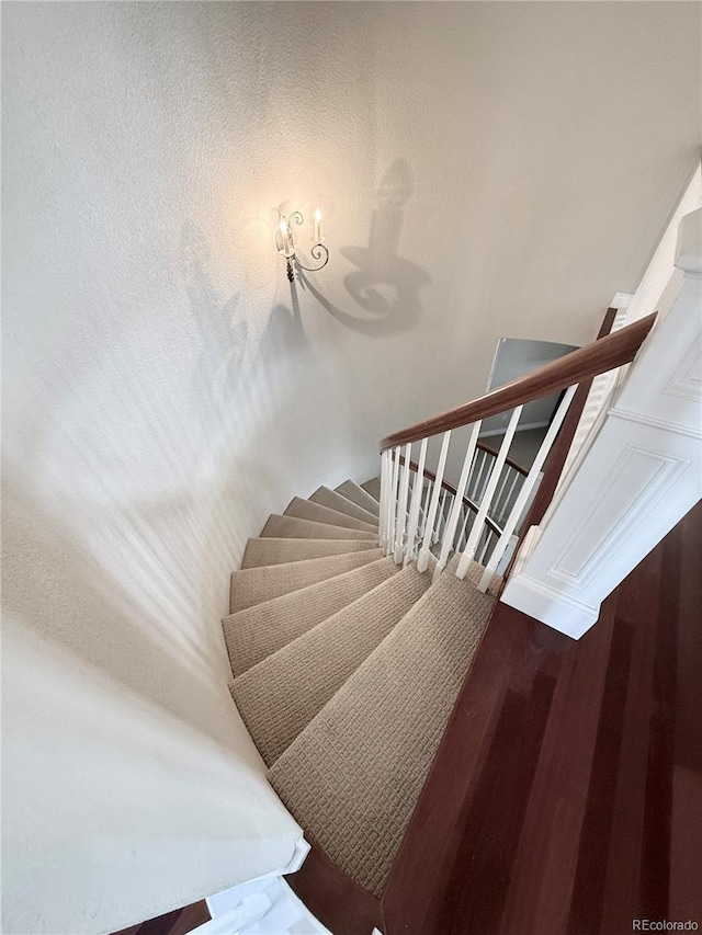 stairs with wood finished floors