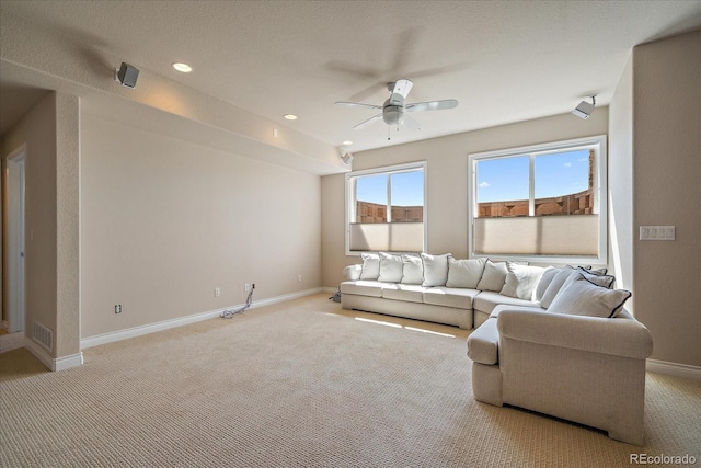 living area with visible vents, light carpet, baseboards, ceiling fan, and recessed lighting