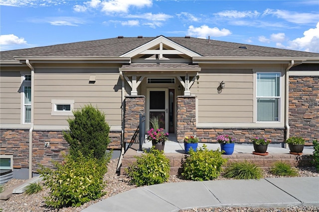 view of front of property with a shingled roof