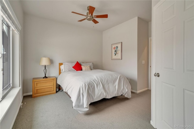 bedroom with carpet, a ceiling fan, and baseboards