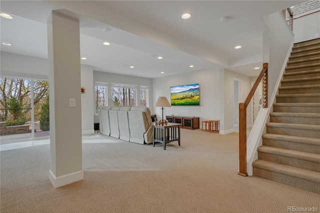 interior space featuring baseboards, stairs, light colored carpet, and recessed lighting