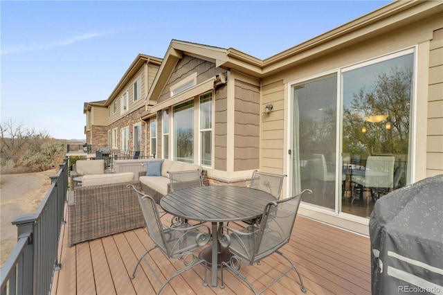 deck with outdoor dining space and an outdoor hangout area