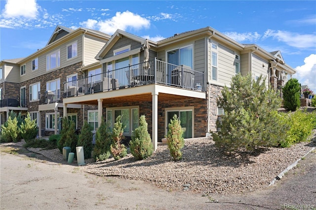 exterior space featuring stone siding