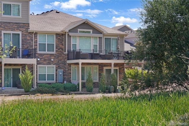 exterior space with a shingled roof