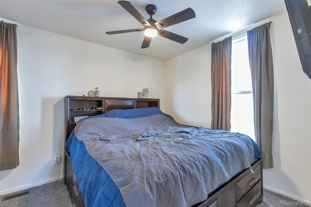 bedroom with ceiling fan and carpet