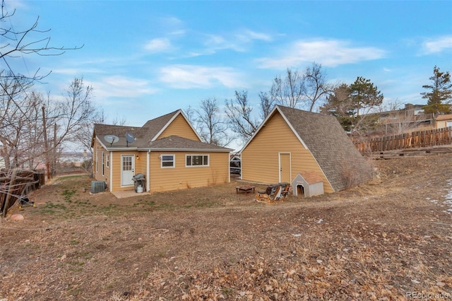 rear view of property featuring central AC unit