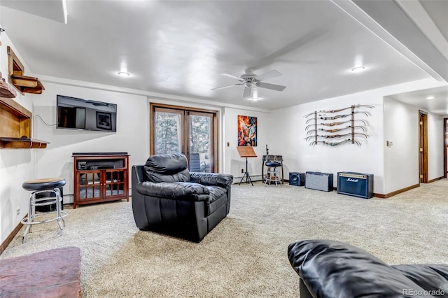 carpeted living room featuring ceiling fan and a baseboard heating unit