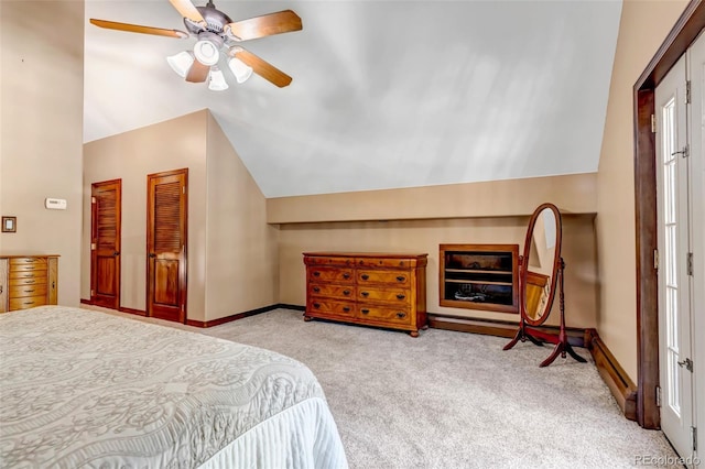 carpeted bedroom featuring lofted ceiling and ceiling fan