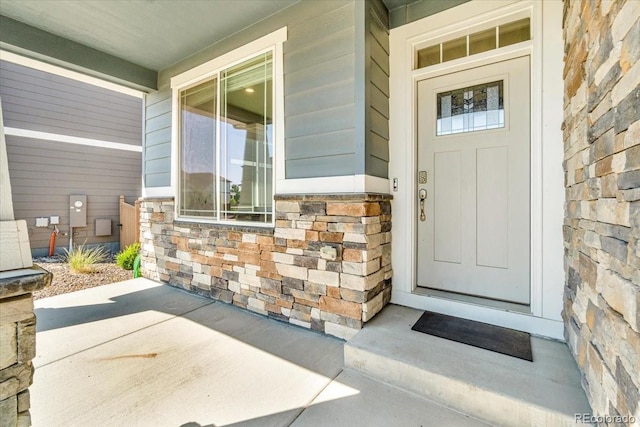 1721 Wingfeather Ln, Castle Rock, CO 80108 - property entrance with stone siding and covered porch