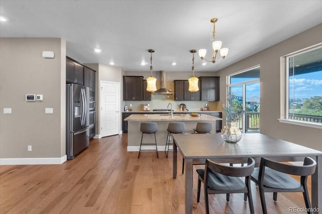 1721 Wingfeather Ln, Castle Rock, CO 80108 - dining room with light wood-style flooring, recessed lighting, and a chandelier