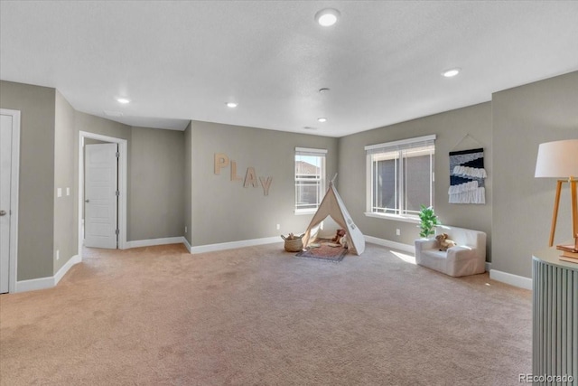 1721 Wingfeather Ln, Castle Rock, CO 80108 - recreation room featuring light colored carpet and recessed lighting
