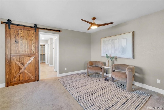 1721 Wingfeather Ln, Castle Rock, CO 80108 - living area with a ceiling fan, a barn door, and light carpet