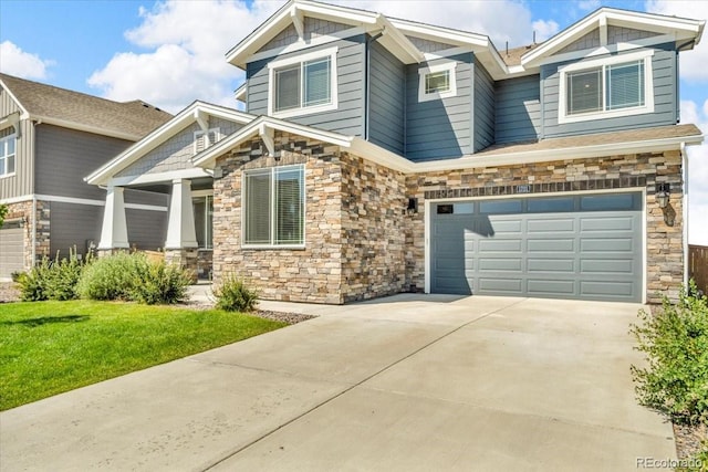 1721 Wingfeather Ln, Castle Rock, CO 80108 - craftsman inspired home with stone siding, concrete driveway, a front lawn, a porch, and a garage