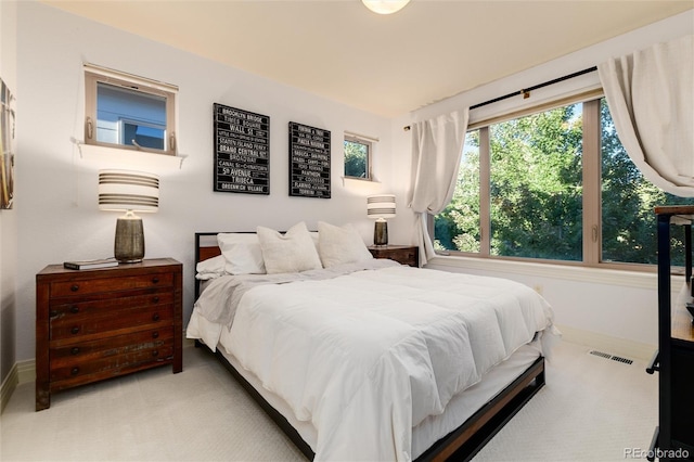 bedroom featuring light colored carpet