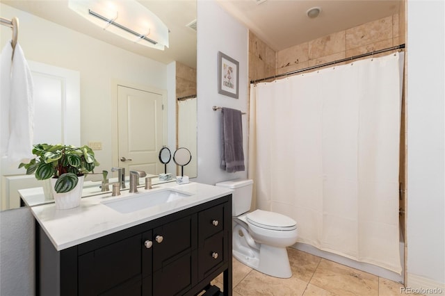 bathroom with tile patterned floors, vanity, a shower with shower curtain, and toilet