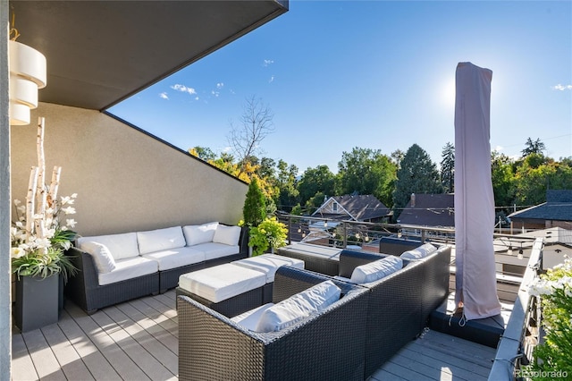 wooden terrace featuring outdoor lounge area