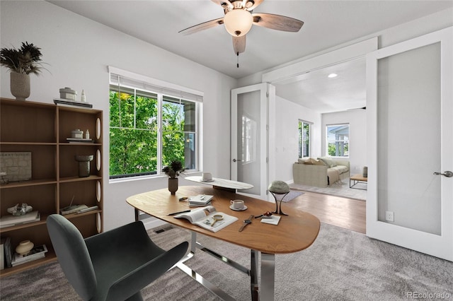 17970 E 106th Pl, Commerce City, CO 80022 - home office featuring healthy amount of natural light, ceiling fan, and carpet