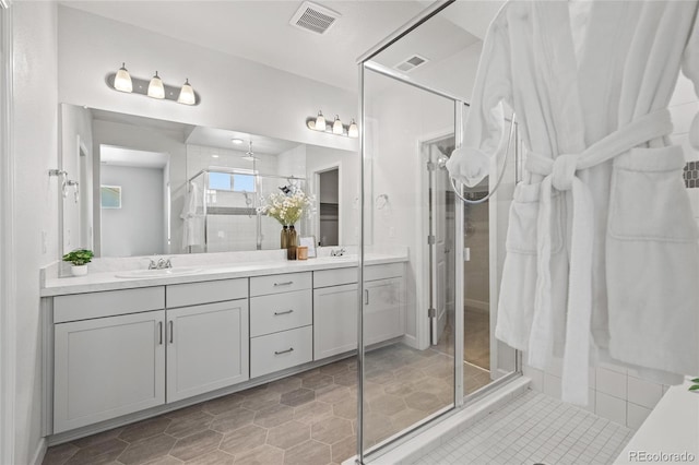 17970 E 106th Pl, Commerce City, CO 80022 - full bath featuring a stall shower, double vanity, and tile patterned flooring