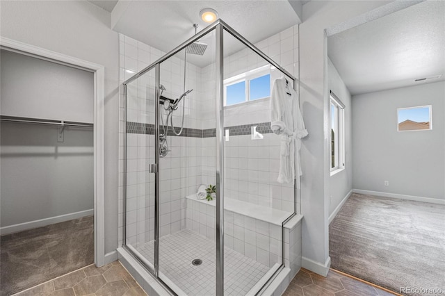 17970 E 106th Pl, Commerce City, CO 80022 - bathroom featuring a walk in closet and a stall shower