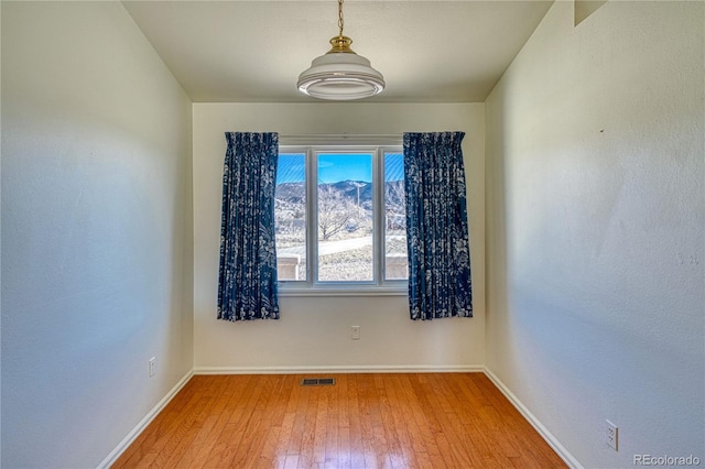 unfurnished room featuring hardwood / wood-style floors