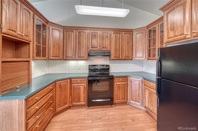 kitchen featuring extractor fan, lofted ceiling, backsplash, light hardwood / wood-style floors, and black appliances