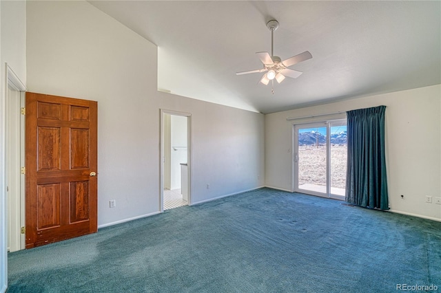 carpeted spare room with ceiling fan and lofted ceiling