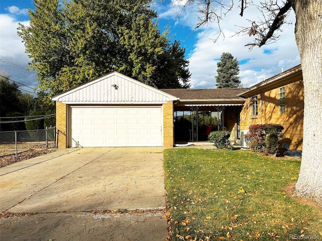 view of side of property with a garage and a yard