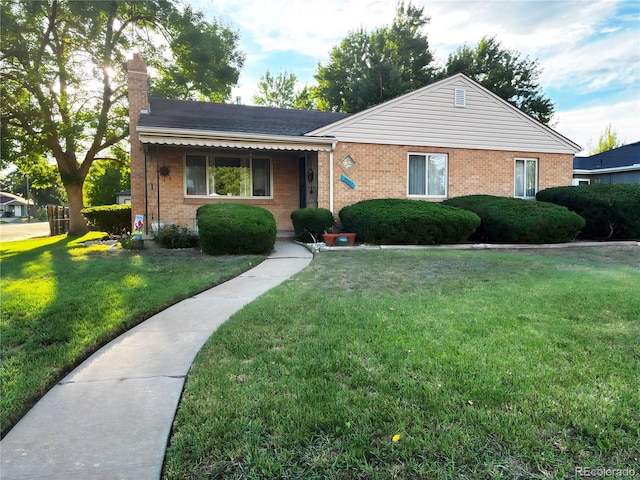 ranch-style home with a front yard