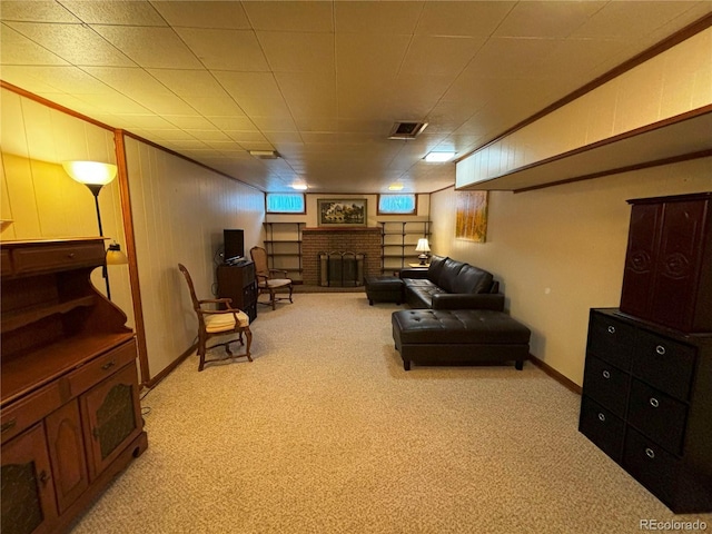 carpeted living room with a fireplace