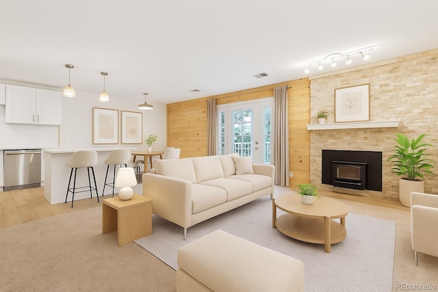 29656 Buffalo Park Rd Unit 208, Evergreen, CO 80439 - living area with light wood-style flooring and a large fireplace