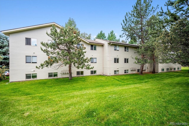 29656 Buffalo Park Rd Unit 208, Evergreen, CO 80439 - back of property featuring a lawn