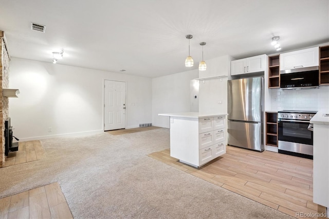 29656 Buffalo Park Rd Unit 208, Evergreen, CO 80439 - kitchen with appliances with stainless steel finishes, open shelves, light countertops, white cabinets, and open floor plan