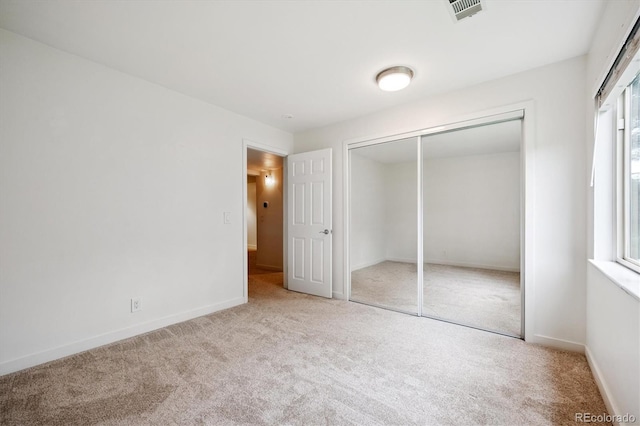 29656 Buffalo Park Rd Unit 208, Evergreen, CO 80439 - unfurnished bedroom featuring carpet flooring and a closet