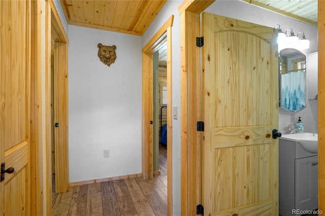 2474 Wendt Ln, Fort Garland, CO 81133 - hallway featuring wood ceiling and light wood finished floors