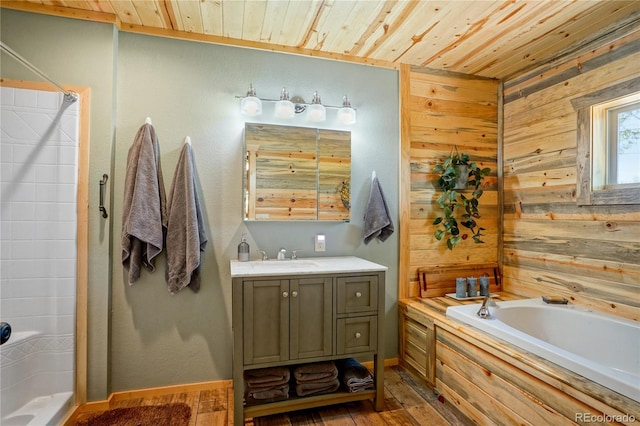 2474 Wendt Ln, Fort Garland, CO 81133 - full bath featuring wooden walls, a bath, a stall shower, vanity, and wood finished floors