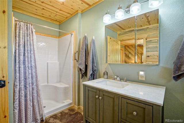 2474 Wendt Ln, Fort Garland, CO 81133 - full bath featuring wooden ceiling, a textured wall, vanity, and a shower stall