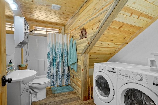 2474 Wendt Ln, Fort Garland, CO 81133 - laundry room with washing machine and clothes dryer, wood ceiling, wood finished floors, and wooden walls