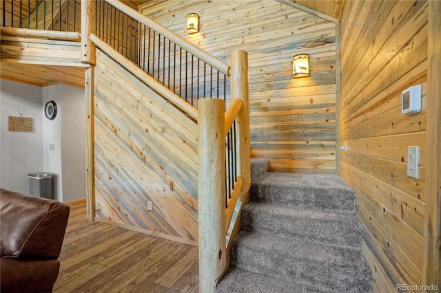2474 Wendt Ln, Fort Garland, CO 81133 - staircase featuring wooden walls and wood finished floors