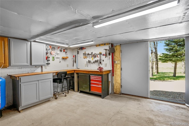 2474 Wendt Ln, Fort Garland, CO 81133 - bar with a workshop area and concrete floors