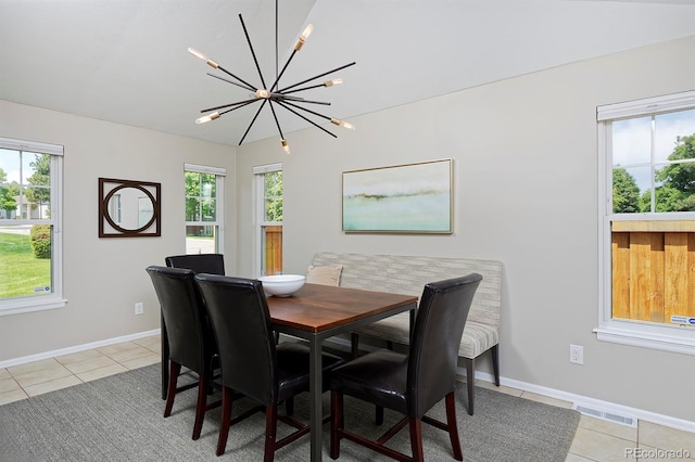 690 W Jamison Cir, Littleton, CO 80120 - dining room featuring a chandelier, light tile patterned floors, and baseboards