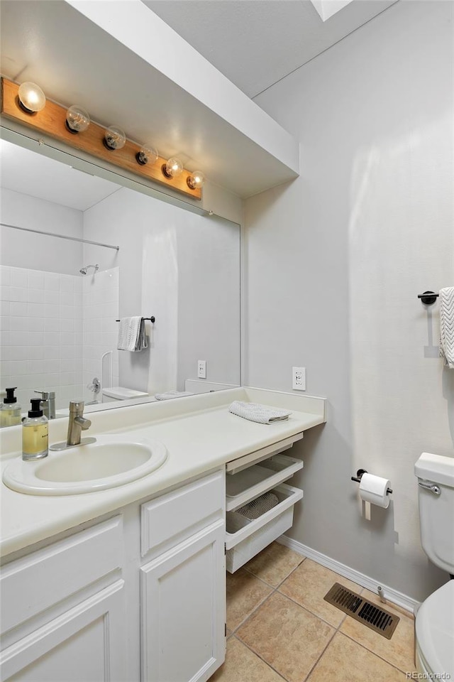 690 W Jamison Cir, Littleton, CO 80120 - bathroom with toilet, vanity, baseboards, and tile patterned flooring