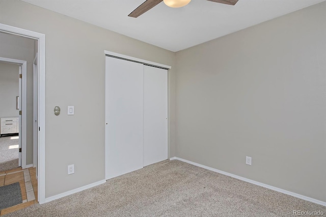 690 W Jamison Cir, Littleton, CO 80120 - unfurnished bedroom featuring carpet, a closet, ceiling fan, and baseboards