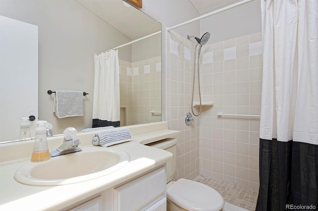 690 W Jamison Cir, Littleton, CO 80120 - bathroom with vanity, tiled shower, and toilet