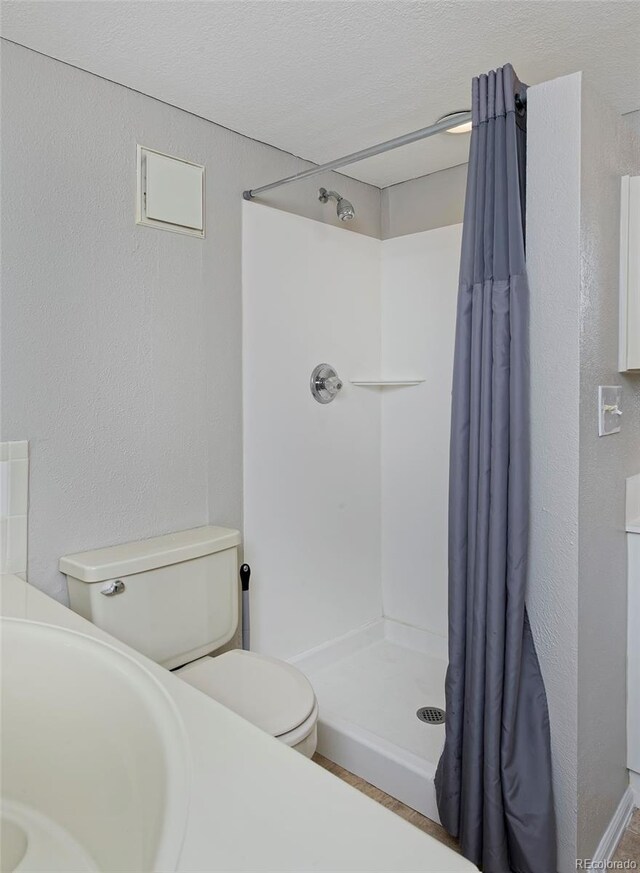 690 W Jamison Cir, Littleton, CO 80120 - full bath with toilet and a shower stall